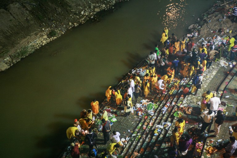 Hindu devotees performs a religious bath outside of the Batu Caves Temple during the Thaipusam festival on February 03, 2015. The Hindu festival of Thaipusam, commemorates the day when Goddess Parvati gave Lord Murugan a Vel, a divine javelin to destroy the evil demon Soorapadman. photo Aizzat Nordin